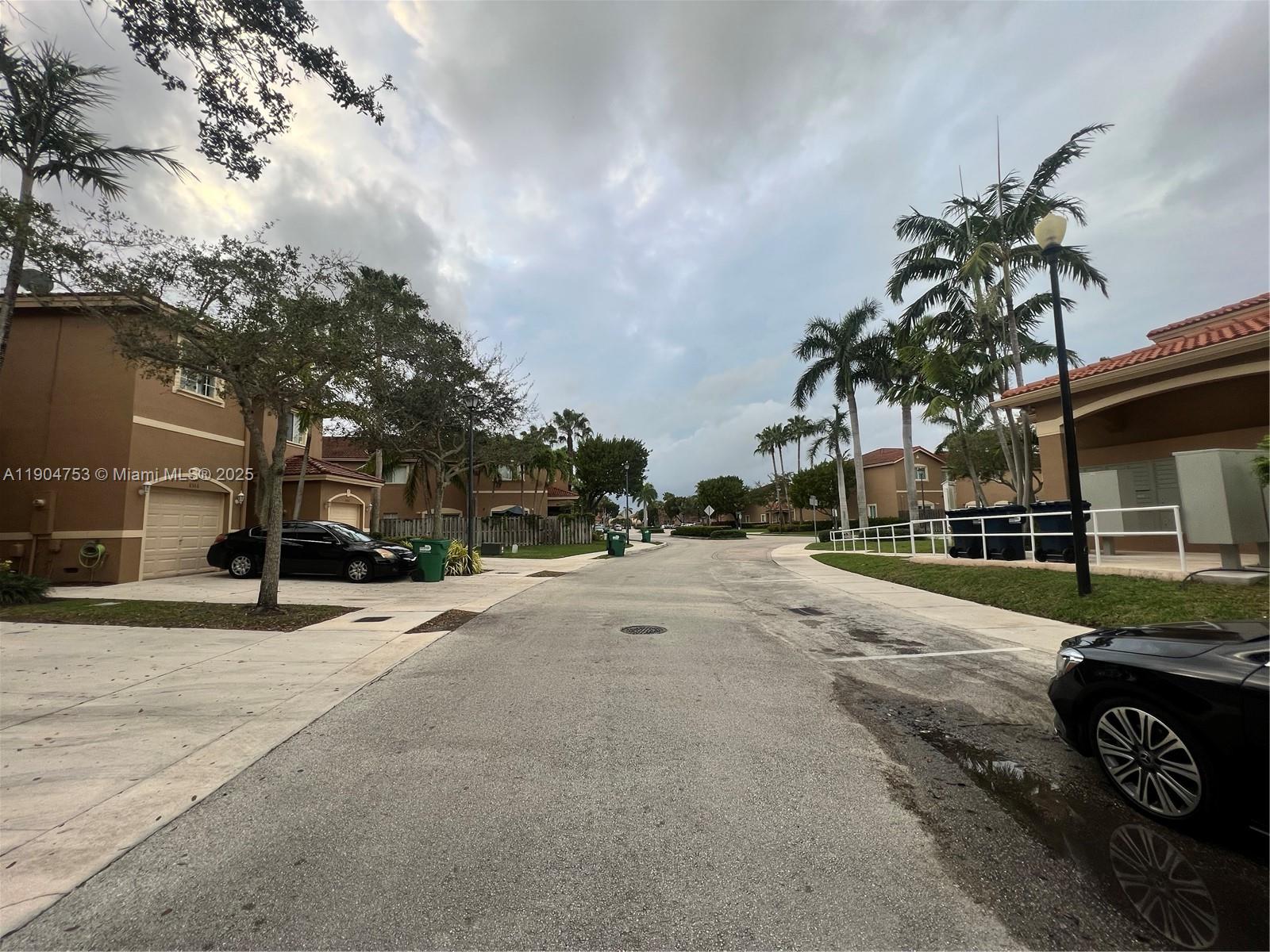 8564 Southwest 214th Way Cutler Bay, FL 33189 - Photo 28 of 31 a street view with a building