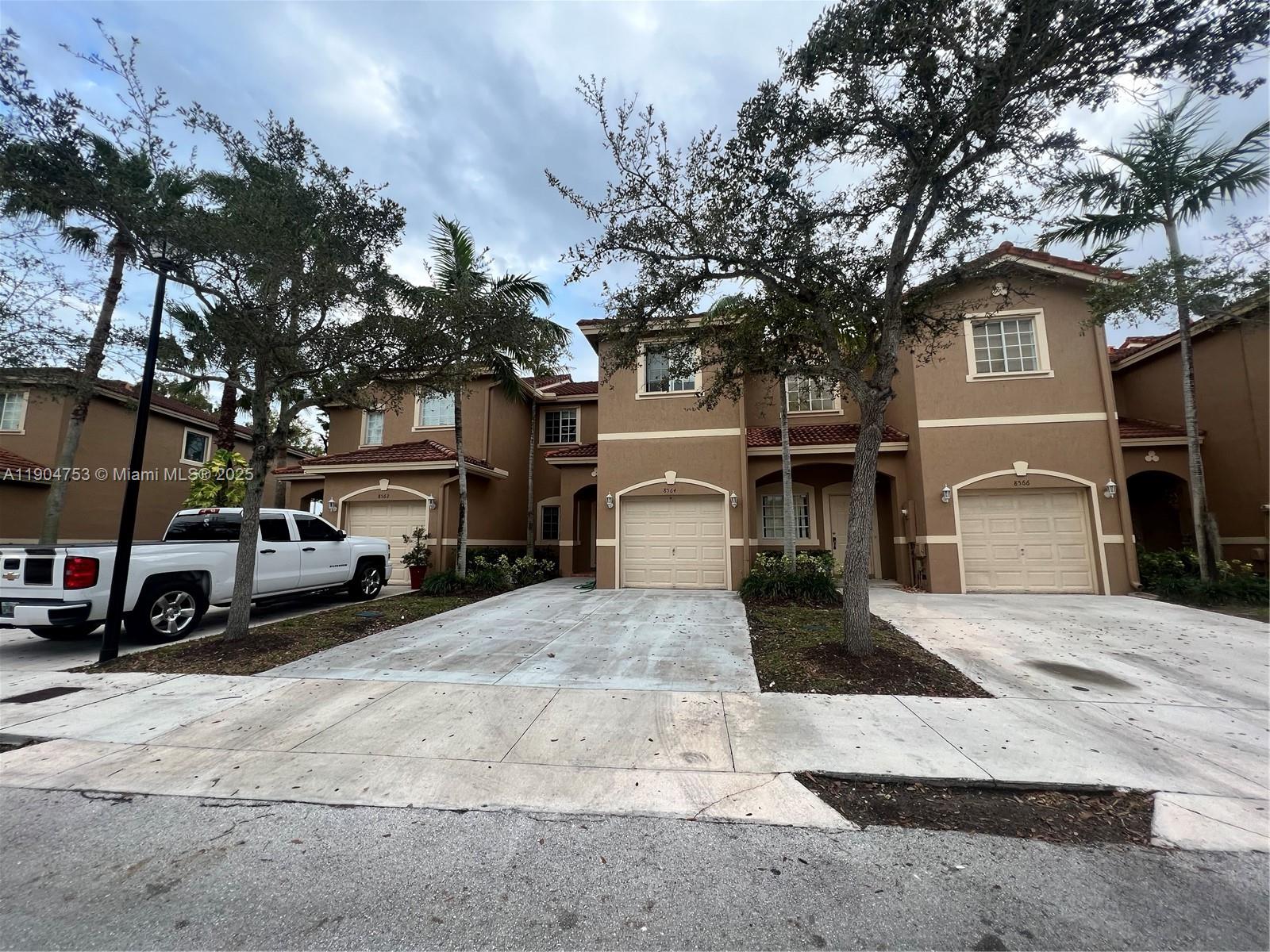 8564 Southwest 214th Way Cutler Bay, FL 33189 - Photo 31 of 31 a view of street with parked cars