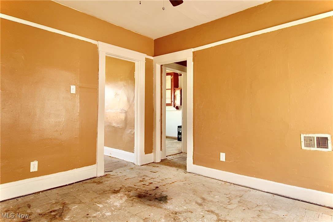 12406 Kinsman Road Cleveland, OH 44120 - Photo 4 of 29 Spare room featuring baseboards and ceiling fan