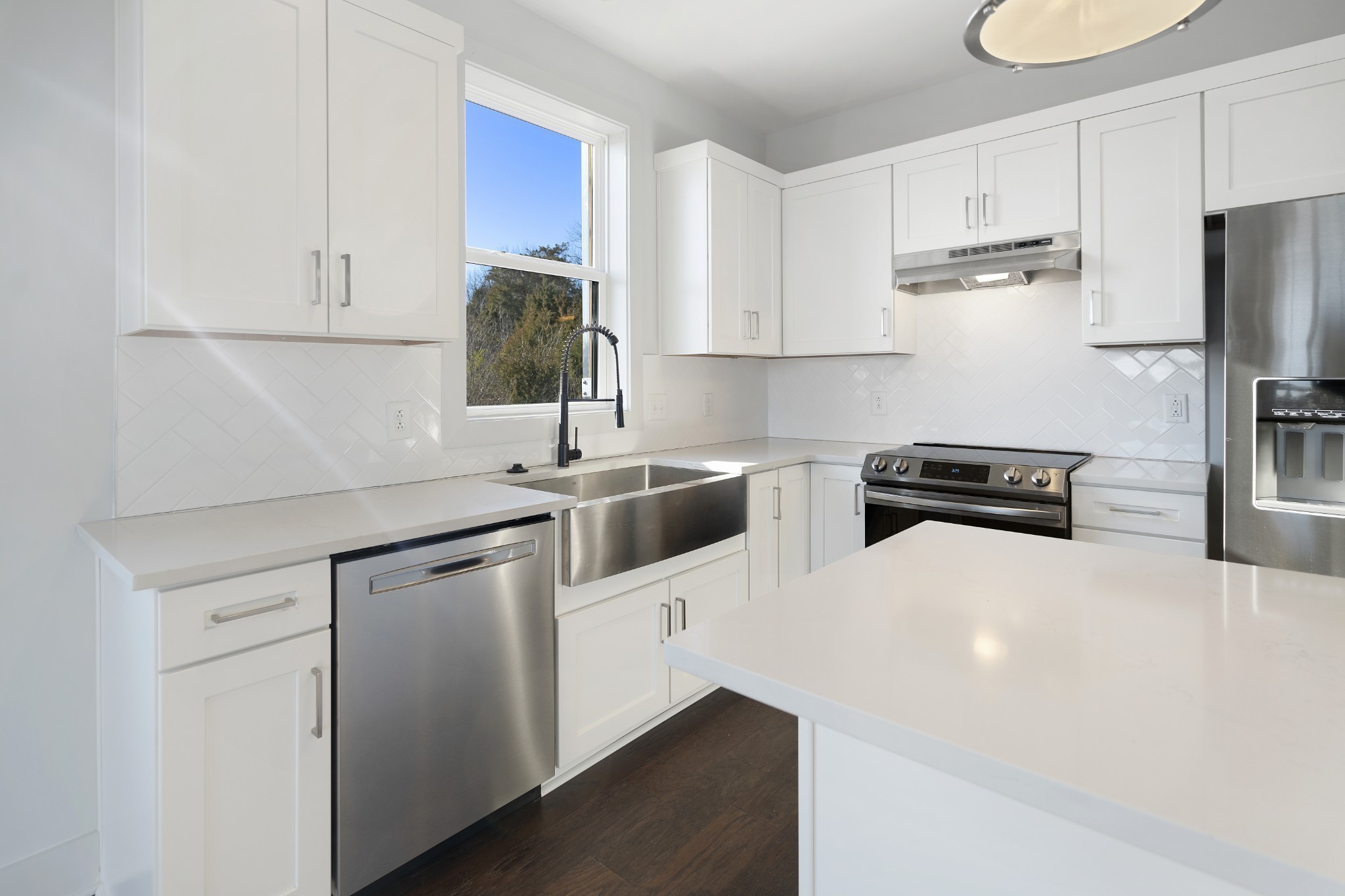710 Inspiration Boulevard Madison, TN 37115 - Photo 13 of 43 a kitchen with stainless steel appliances a refrigerator sink and white cabinets