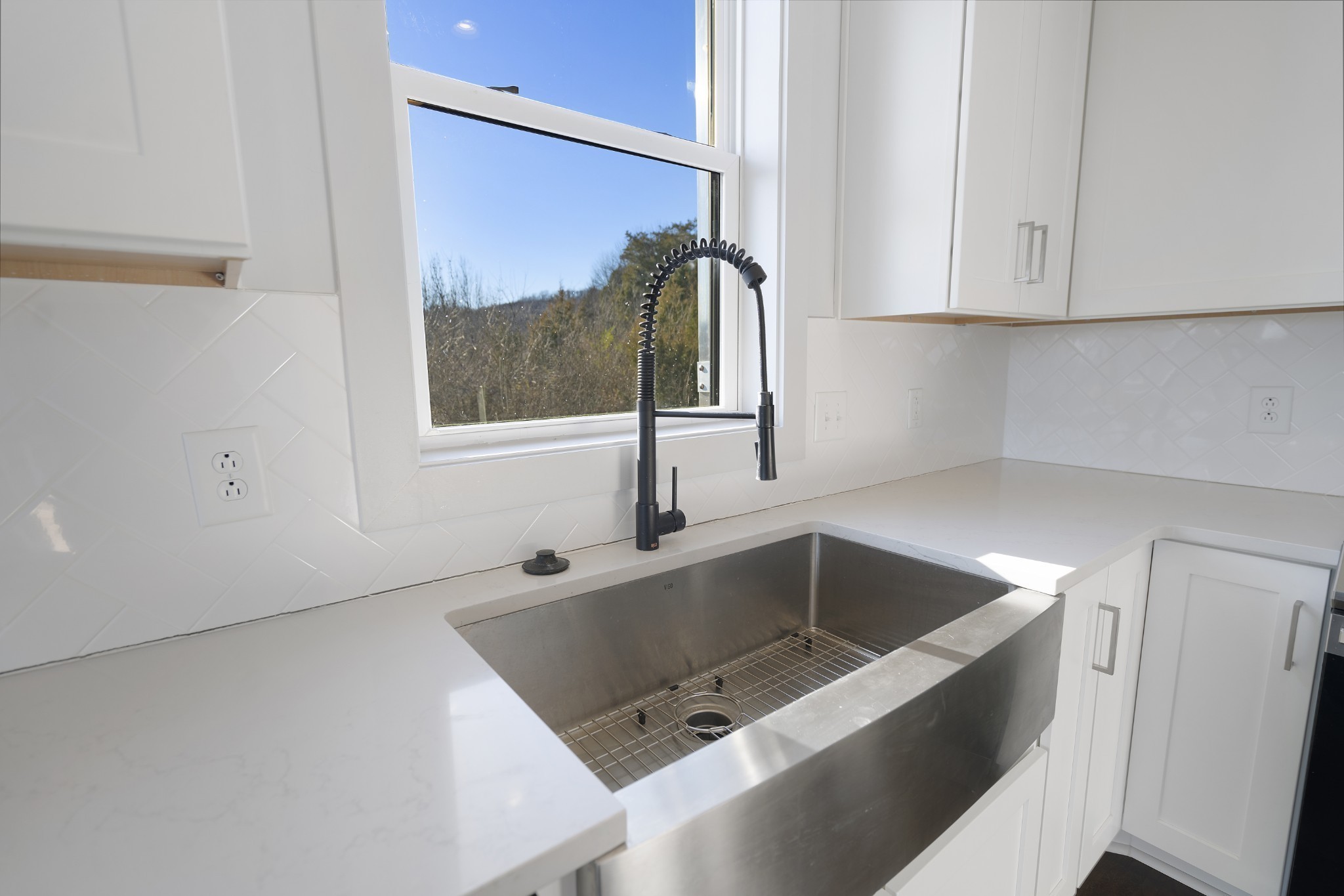 710 Inspiration Boulevard Madison, TN 37115 - Photo 14 of 43 a kitchen with a sink and a refrigerator