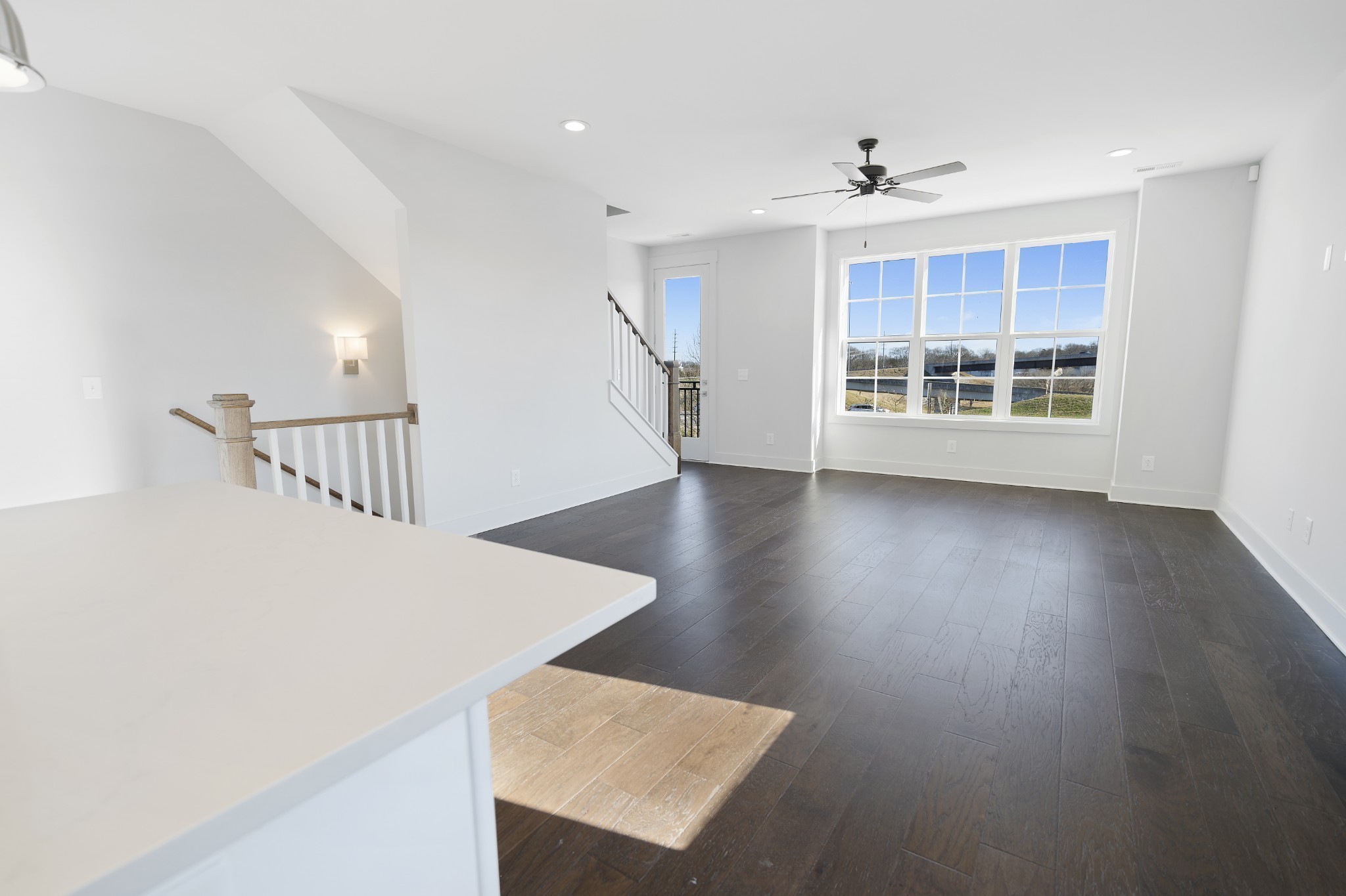710 Inspiration Boulevard Madison, TN 37115 - Photo 15 of 43 a view of an empty room with wooden floor and a window