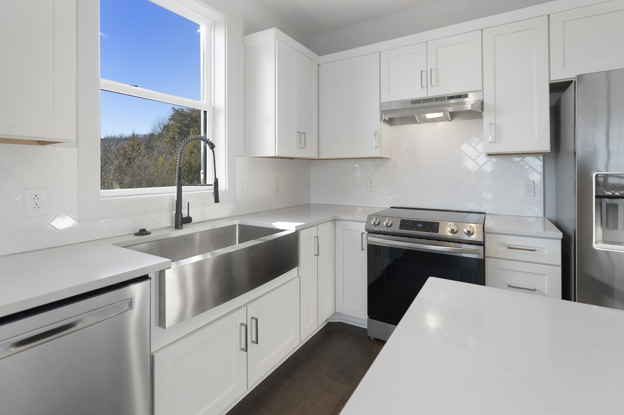 710 Inspiration Boulevard Madison, TN 37115 - Photo 18 of 43 a kitchen with stainless steel appliances a sink stove and refrigerator