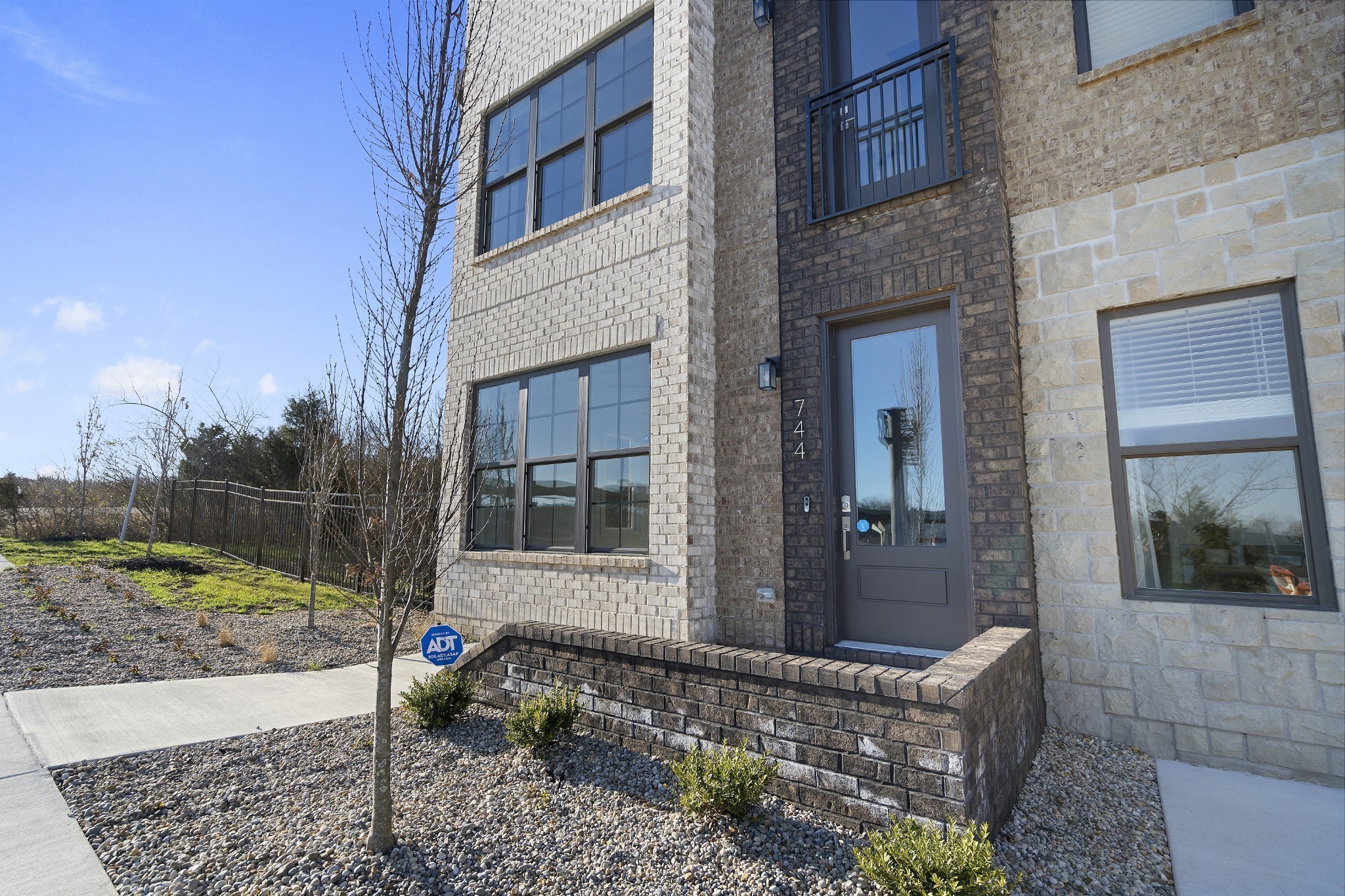 710 Inspiration Boulevard Madison, TN 37115 - Photo 3 of 43 a view of a door with a chair and a fire pit