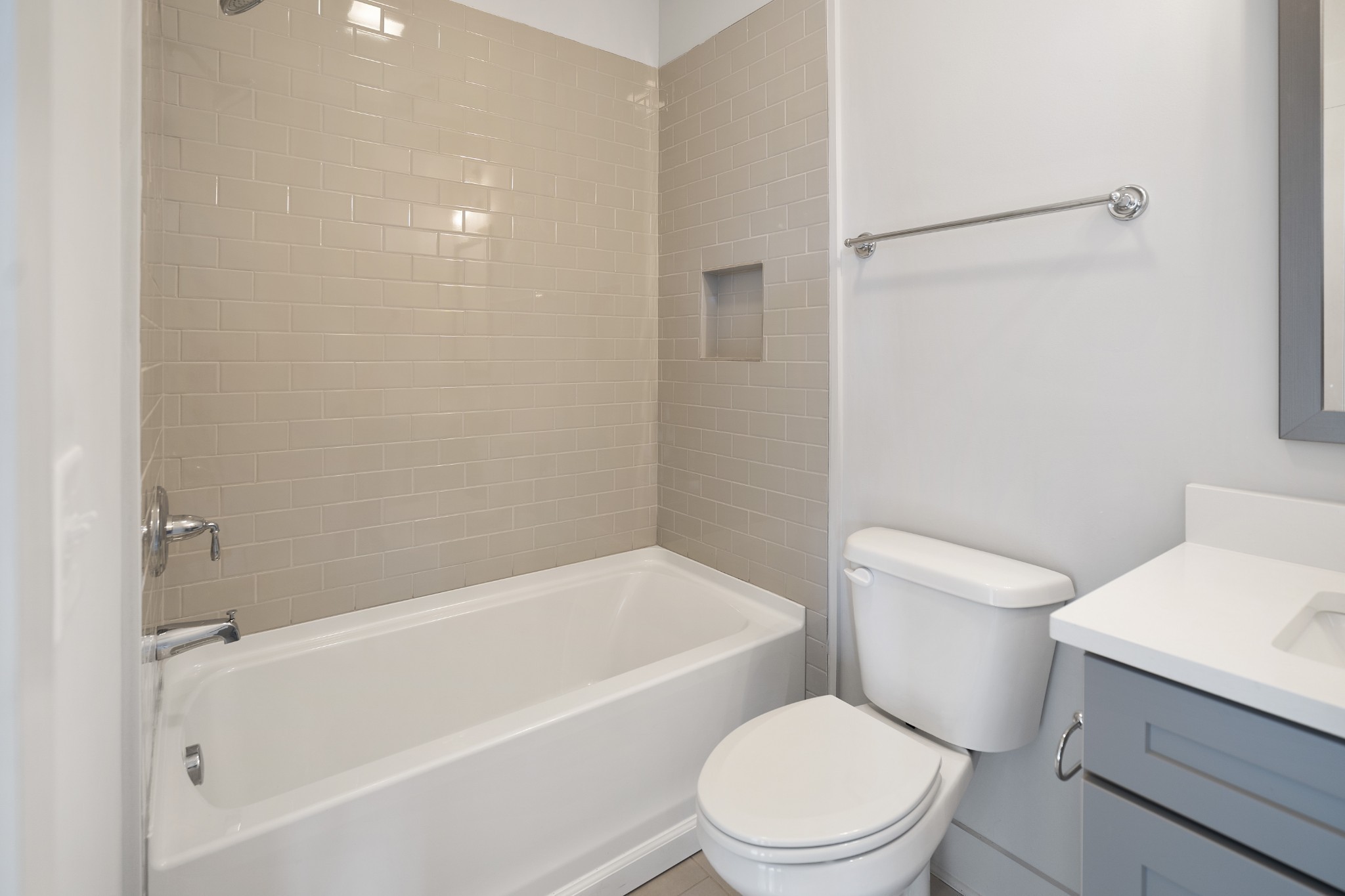 710 Inspiration Boulevard Madison, TN 37115 - Photo 22 of 43 a white toilet sitting next to a bath tub