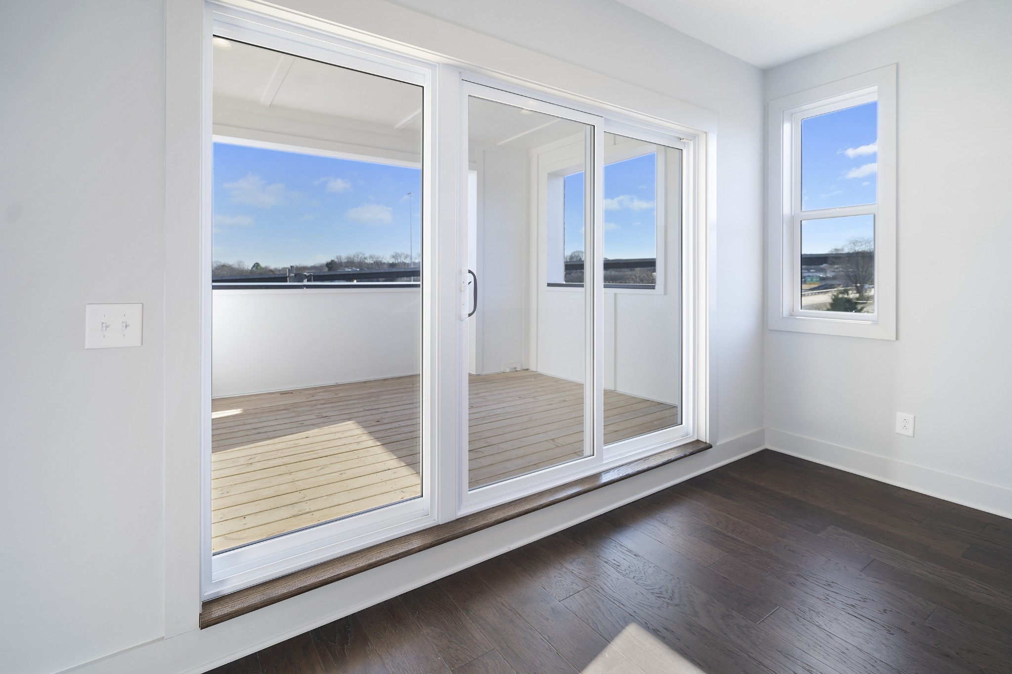 710 Inspiration Boulevard Madison, TN 37115 - Photo 27 of 43 a view of an empty room with wooden floor and a window