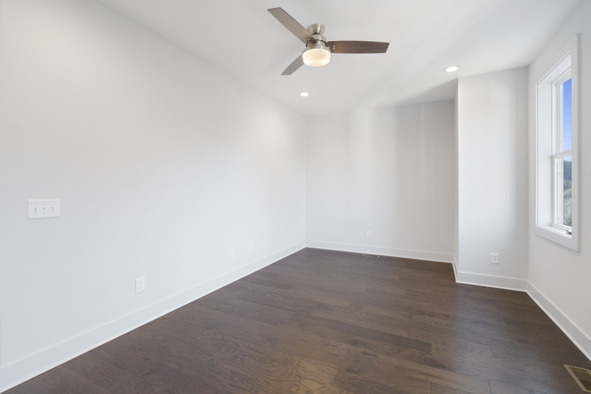 710 Inspiration Boulevard Madison, TN 37115 - Photo 33 of 43 an empty room with wooden floor and windows