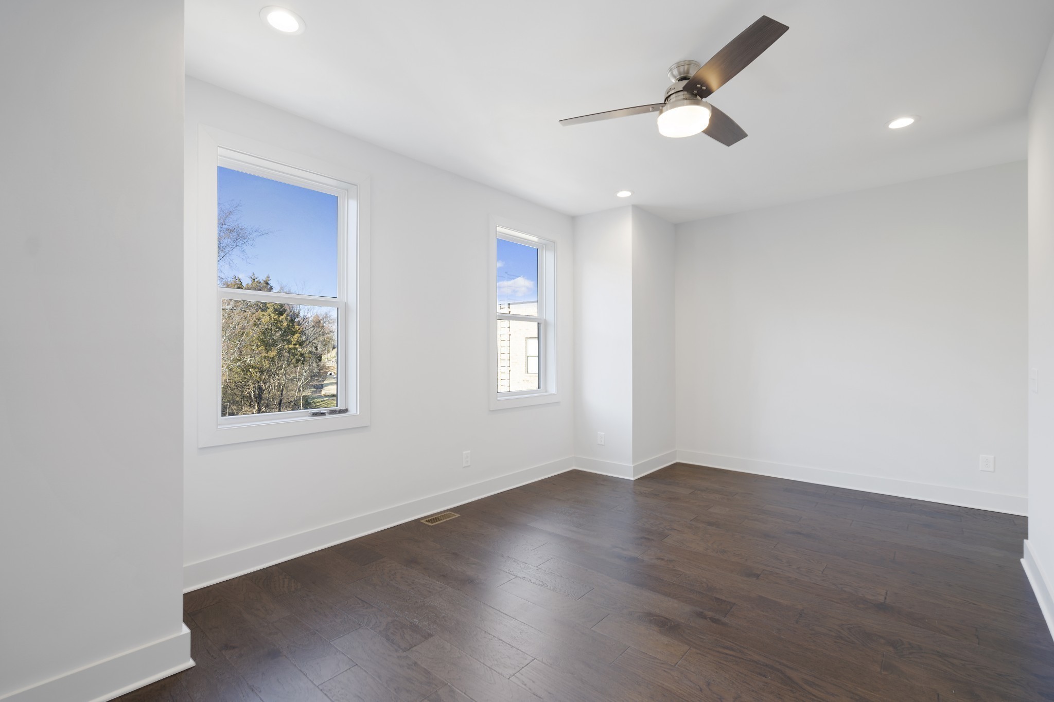 710 Inspiration Boulevard Madison, TN 37115 - Photo 34 of 43 an empty room with wooden floor ceiling fan and windows