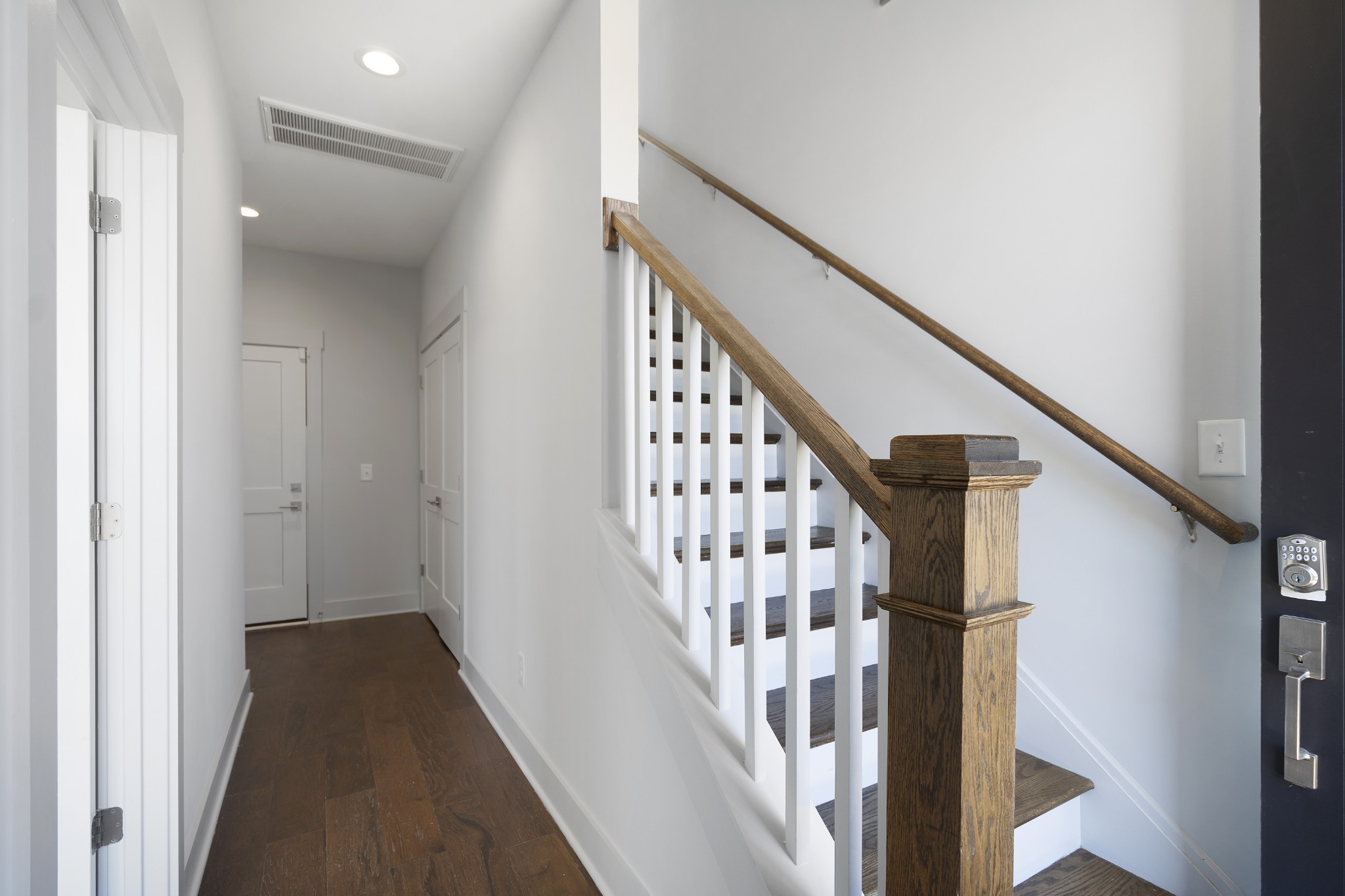 710 Inspiration Boulevard Madison, TN 37115 - Photo 7 of 43 a view of staircase with wooden floor and white walls