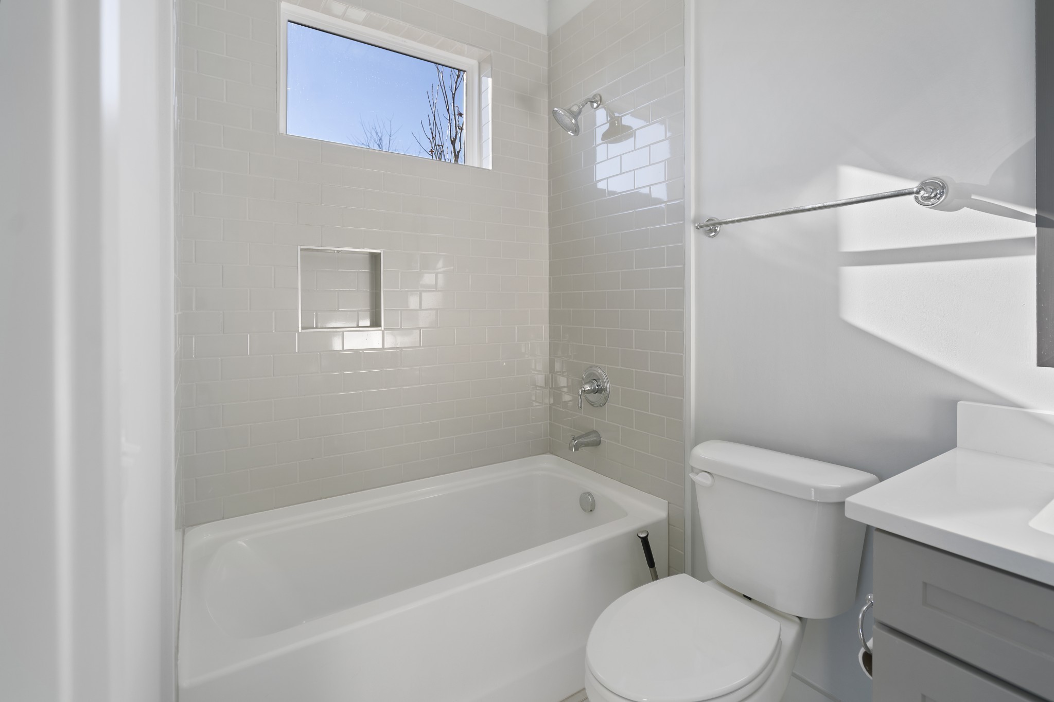 710 Inspiration Boulevard Madison, TN 37115 - Photo 8 of 43 a white toilet sitting next to a bath tub