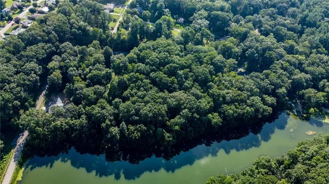 a view of a lake with a yard