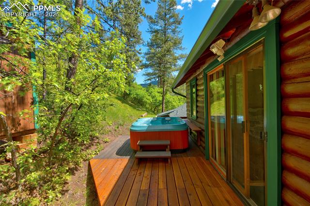 9615 Mountain Road Cascade, CO 80809 - Photo 24 of 31 Hot tub right outside the family room, so private!