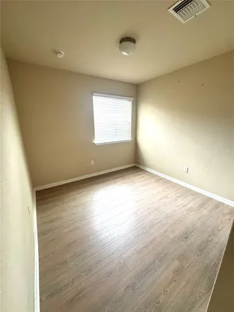 a view of a livingroom with wooden floor