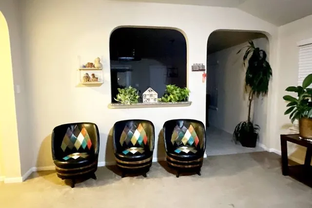 a front view of a fireplace and lots of windows