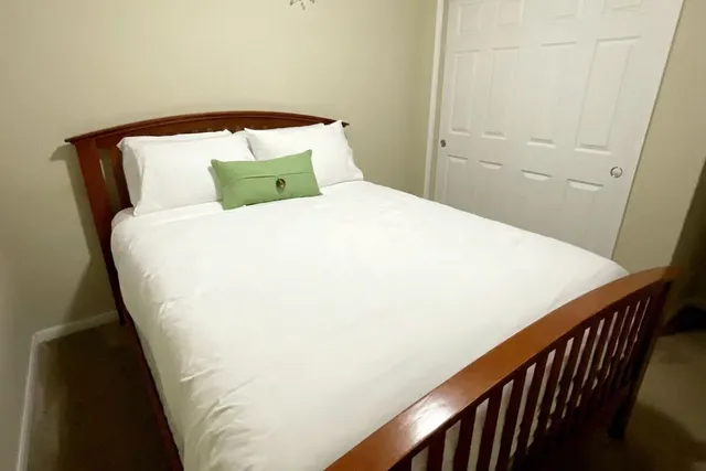 a large bed sitting in a balcony