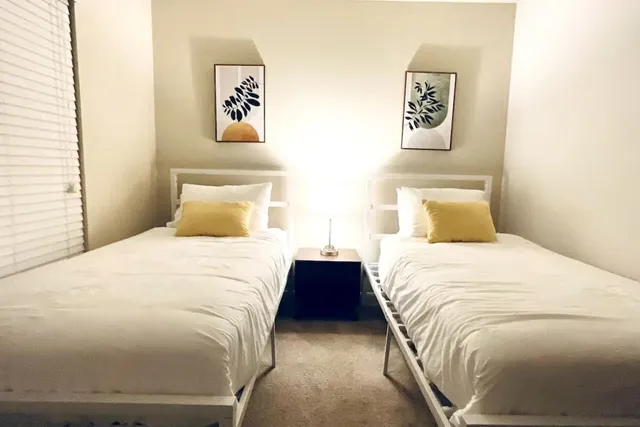 a bedroom with a bed and wall painting