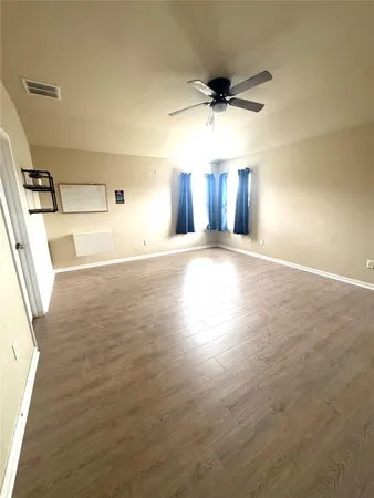 a view of a livingroom with wooden floor