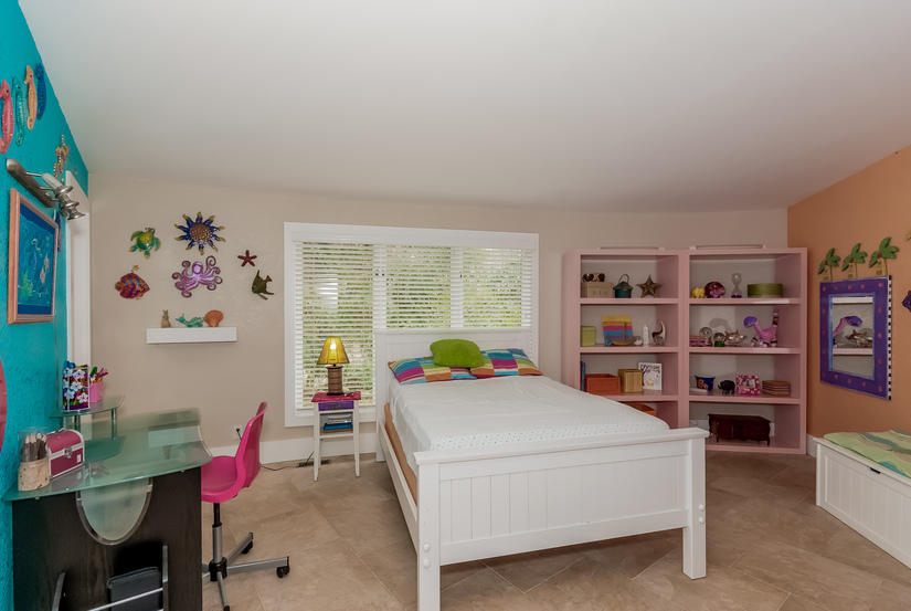 104 Belden Hill Road Wilton, CT 06897 - Photo 15 of 20 a bed room with a bed and a bookshelf