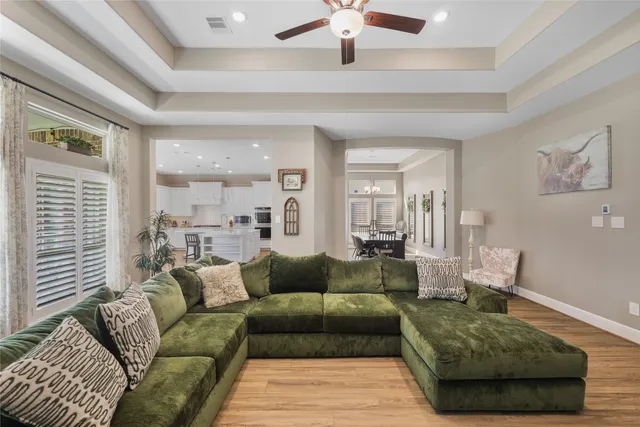 a large kitchen with kitchen island a large island in it