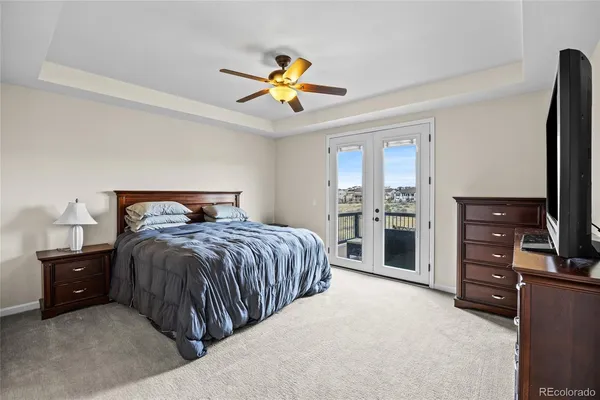 a bedroom with a bed and a tv