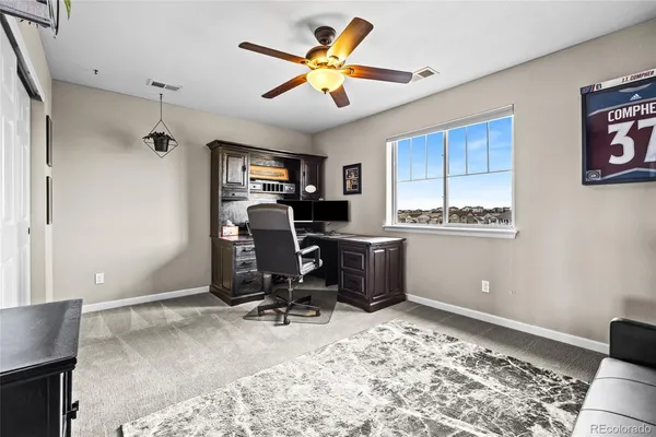 a workspace with furniture and window