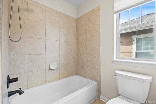 a spacious bathroom with a granite countertop sink a mirror and a