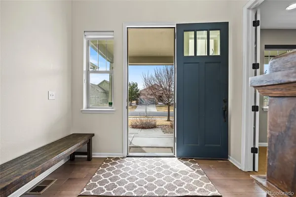 a view of room with window and wooden floor
