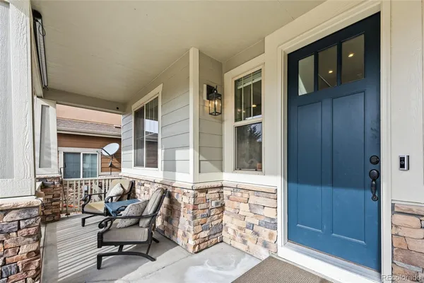 a view of a brick house with outdoor seating space