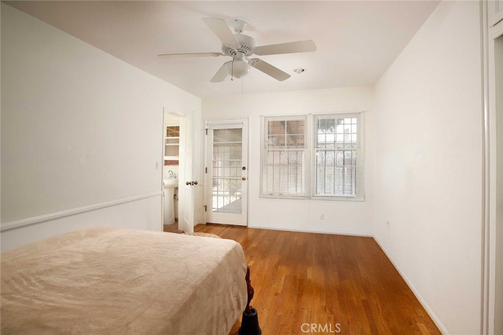 6903 Halbrent Avenue Van Nuys, CA 91405 - Photo 8 of 10 a bedroom with a bed and window