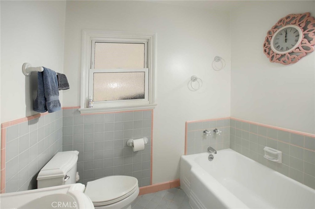 6903 Halbrent Avenue Van Nuys, CA 91405 - Photo 9 of 10 a bathroom with a bathtub sink and toilet