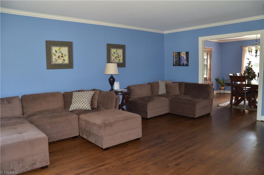 1072 Cantering Road High Point, NC 27262 - Photo 5 of 28 HUGE Living Room with Crown Molding & Refinished Hardwood Flooring.