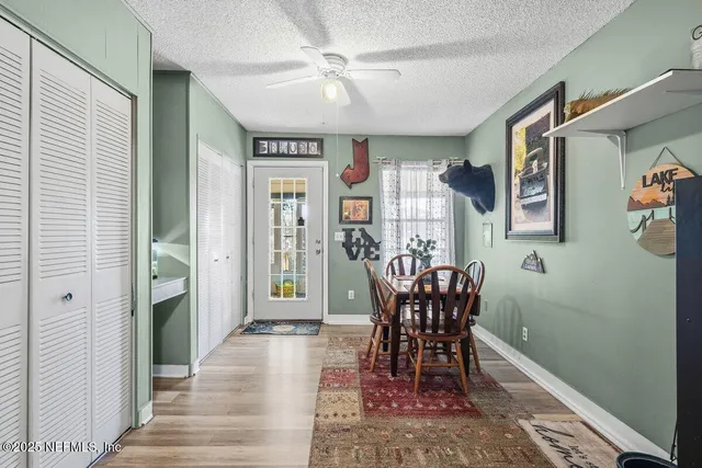 a view of a dining room with furniture window and wooden floor