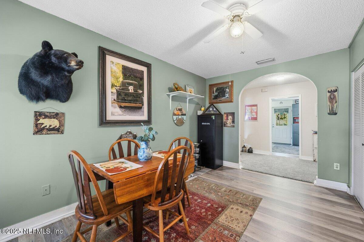832 Lake Shore Terrace Interlachen, FL 32148 - Photo 13 of 42 a dining room with furniture and window