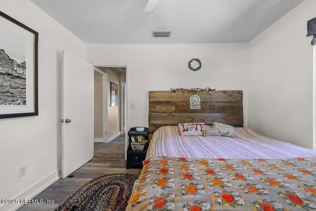 a bedroom with a bed and a table in it