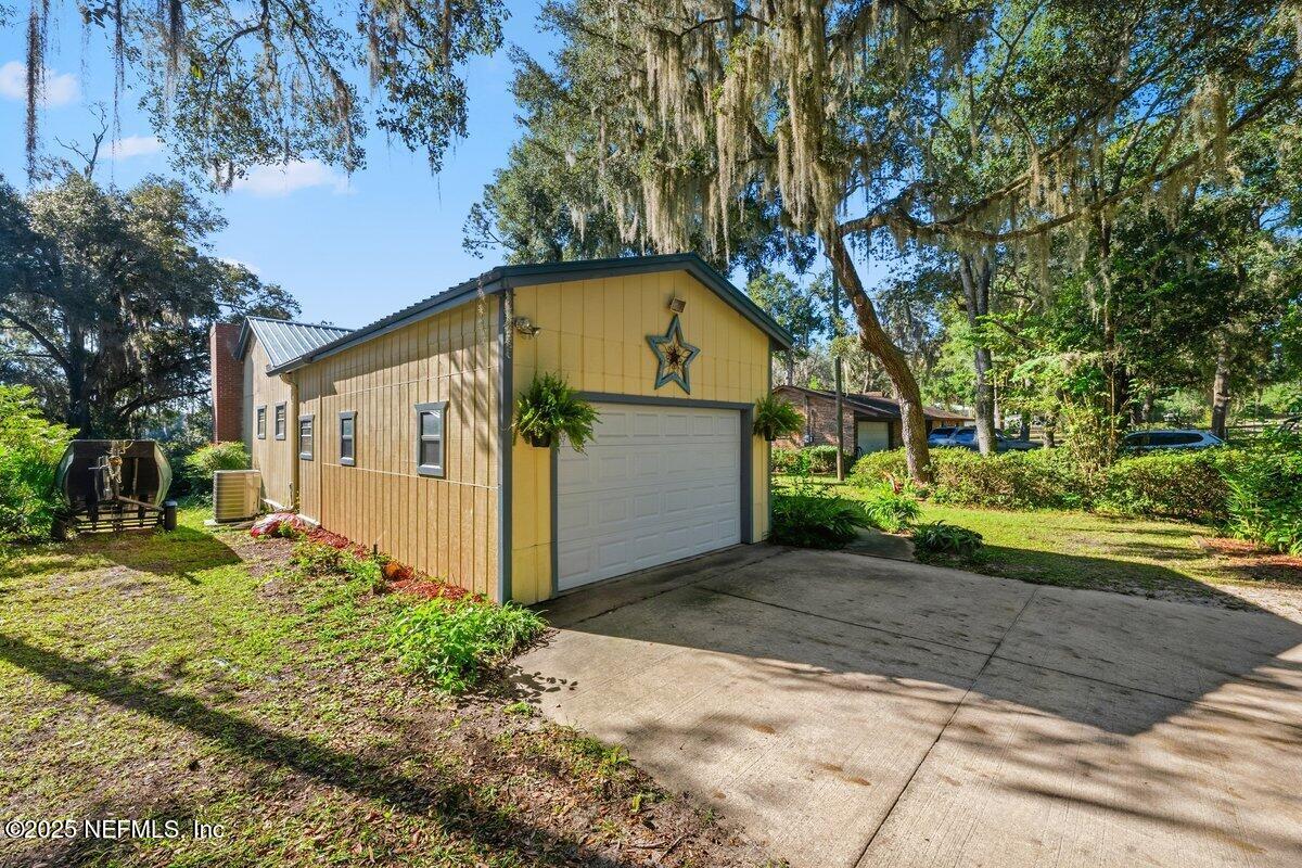 832 Lake Shore Terrace Interlachen, FL 32148 - Photo 2 of 42 a front view of a house with a yard