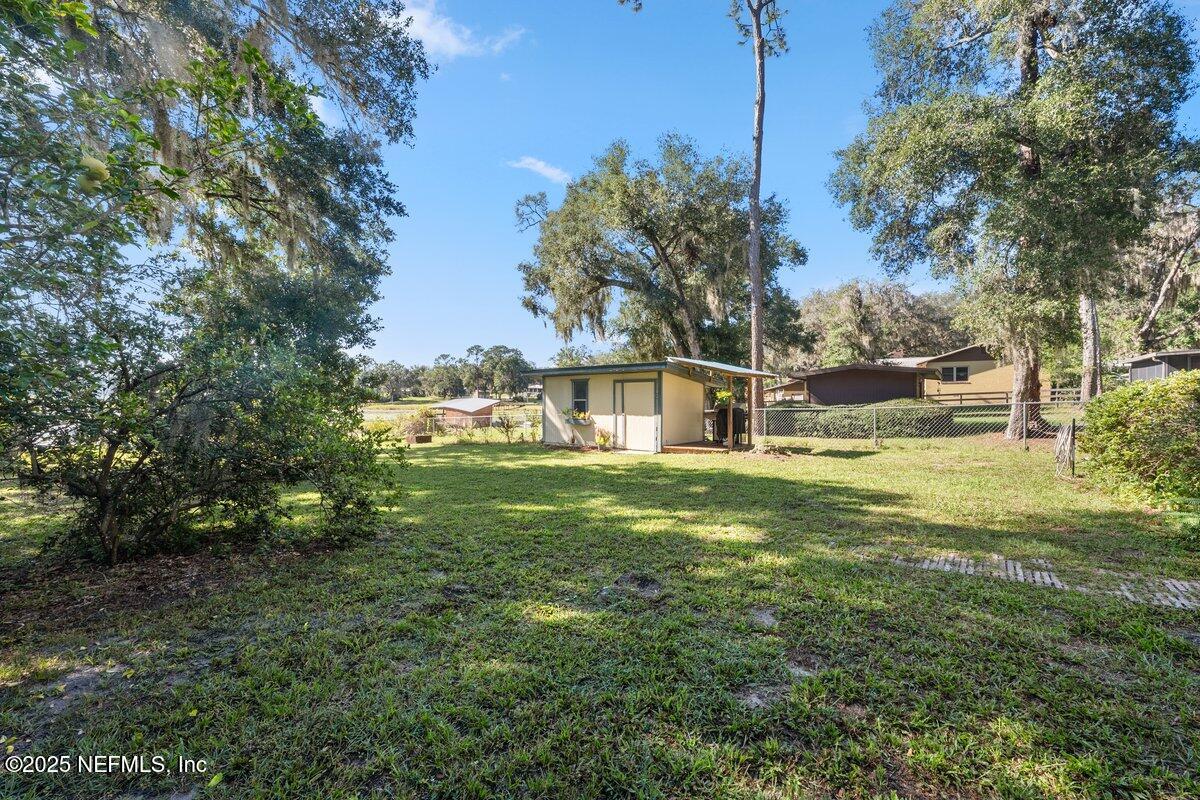 832 Lake Shore Terrace Interlachen, FL 32148 - Photo 22 of 42 a view of a house with a big yard