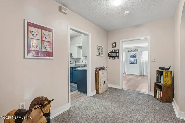 a view of a workspace with furniture and closet