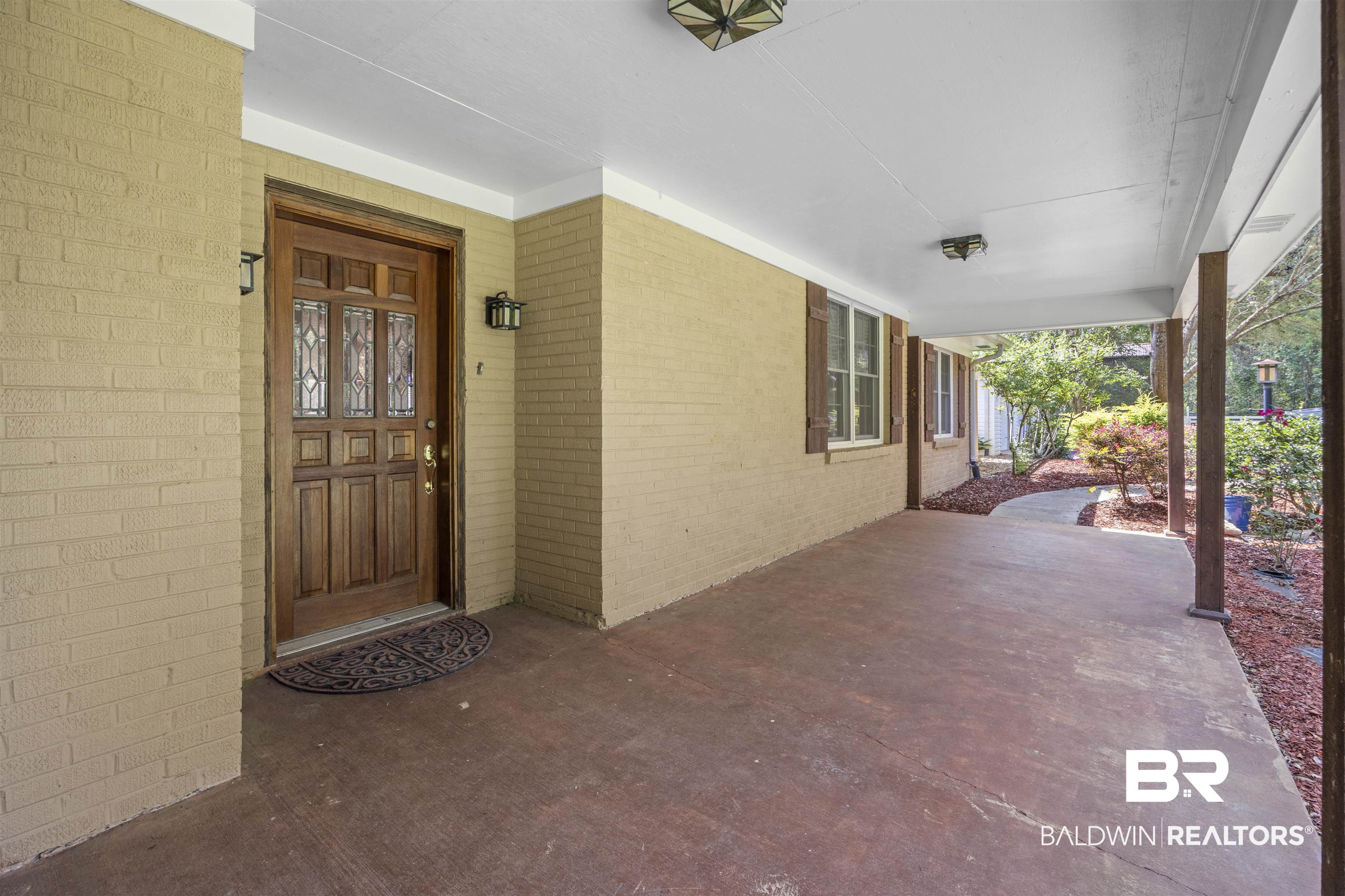 13677 Rebel Road Coden, AL 36523 - Photo 33 of 61 Covered front porch with painted brick exterior