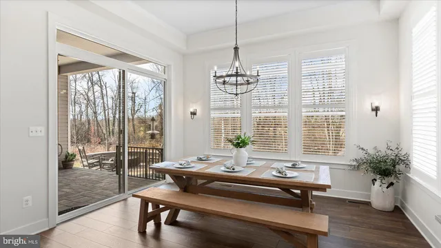 a view of a livingroom with a ceiling fan and window