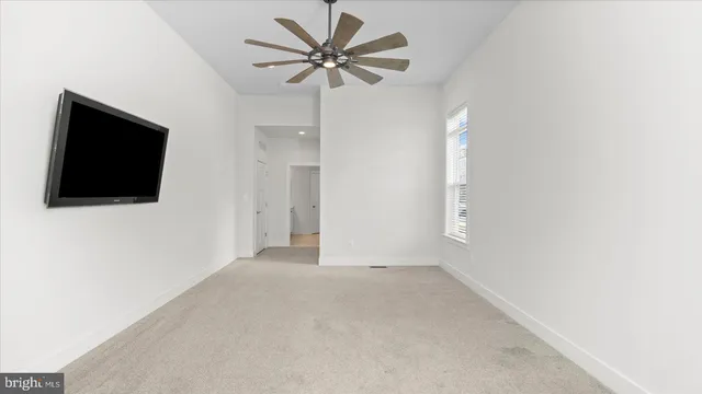 a spacious bathroom with double sink and a mirror