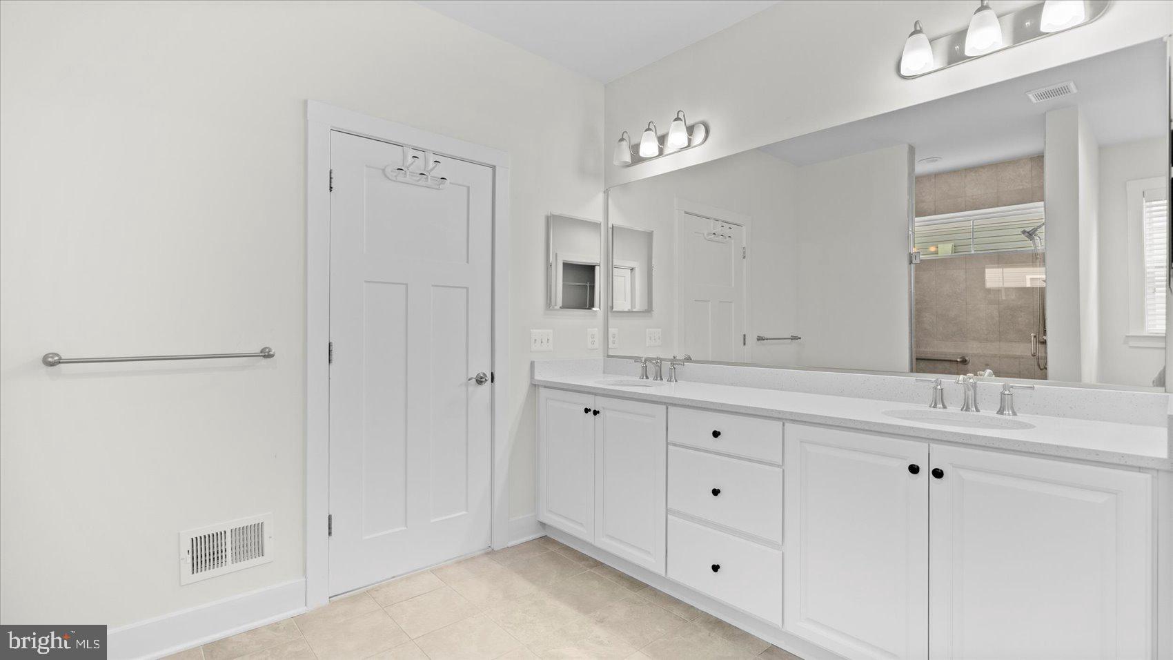 2510 Easy Street Fallston, MD 21047 - Photo 19 of 56 a spacious bathroom with double sink and a mirror