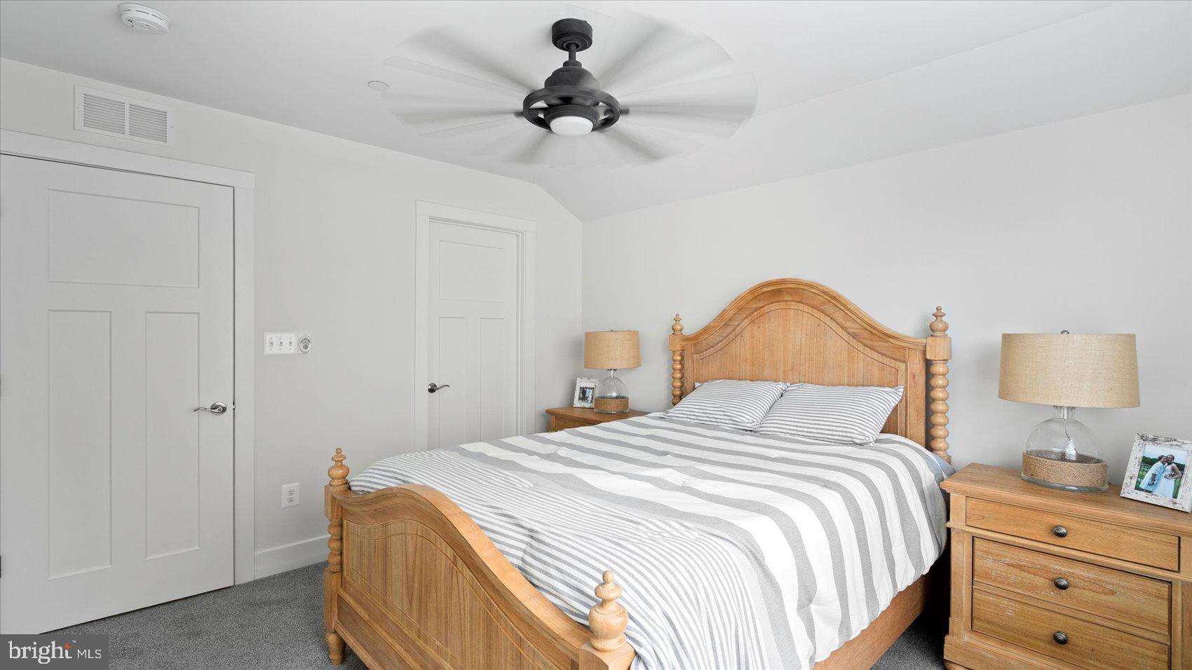2510 Easy Street Fallston, MD 21047 - Photo 25 of 56 a bedroom with a bed and a chandelier