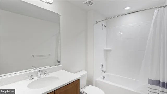 a bathroom with a sink a toilet and a bathtub