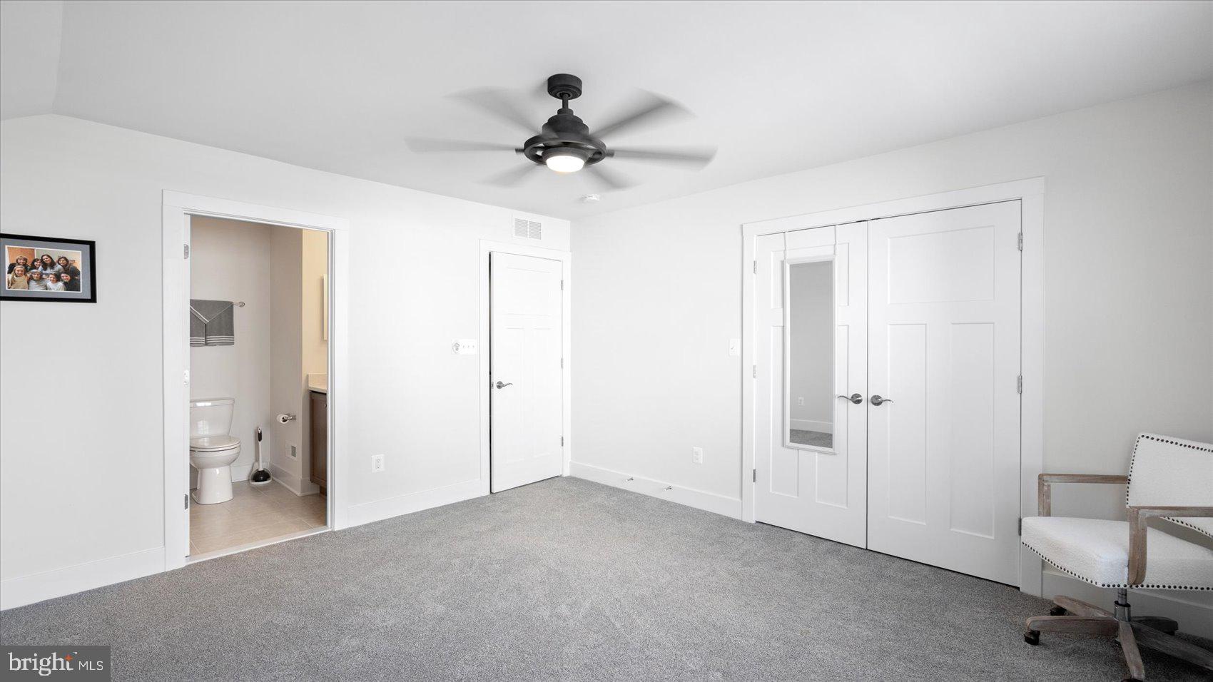 2510 Easy Street Fallston, MD 21047 - Photo 29 of 56 a view of a livingroom with a ceiling fan & cabinetry