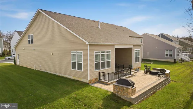 an aerial view of a house with garden space and sitting space