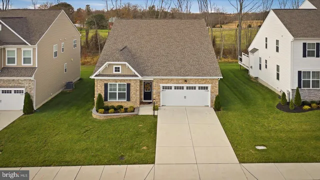 a view of a lake with lawn chairs