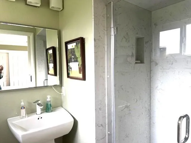 a bathroom with a sink and a mirror