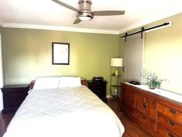 a bedroom with a bed and a dresser