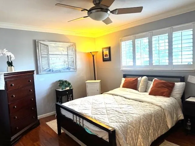 a bedroom with a bed and a window