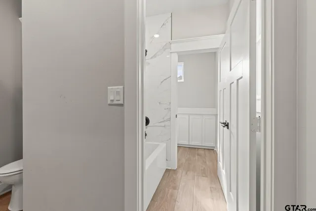 a view of a bathroom from the hallway